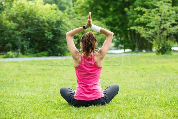 Woman Practicing Yoga Stock photo © AndreyPopov