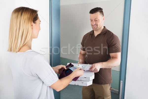 Woman Paying For The Delivered Pizza Stock photo © AndreyPopov