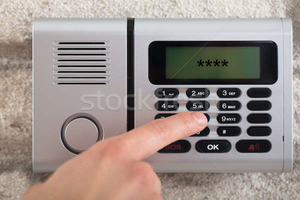 Human Hand Entering Security System Code Stock photo © AndreyPopov