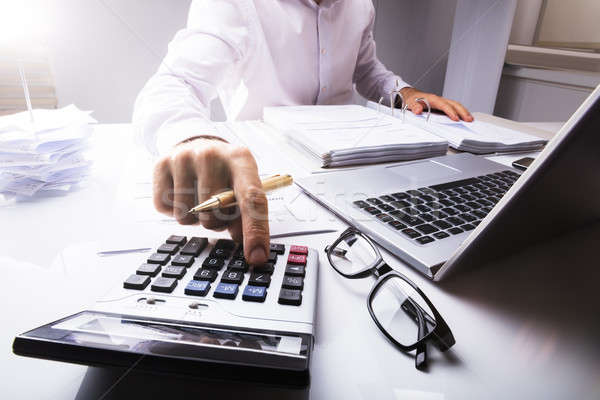 Affaires impôt simulateur portable bureau bureau [[stock_photo]] © AndreyPopov