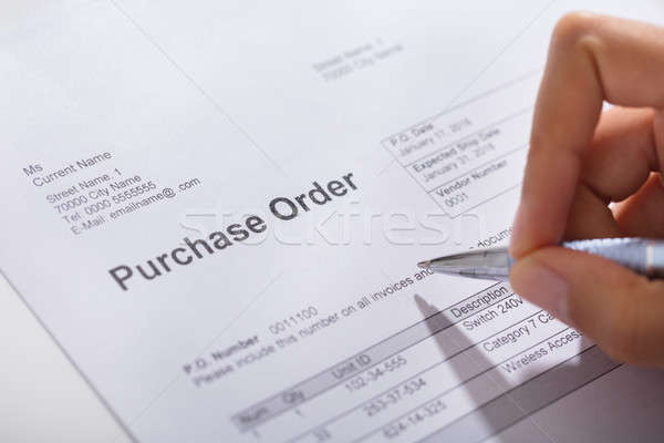 Stock photo: Person Hand Filling A Purchase Order Form