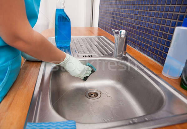 Woman Wearing Apron Cleaning Kitchen Sink Stock photo © AndreyPopov