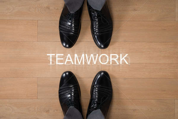Businessmen Standing With Teamwork Written On Floor Stock photo © AndreyPopov