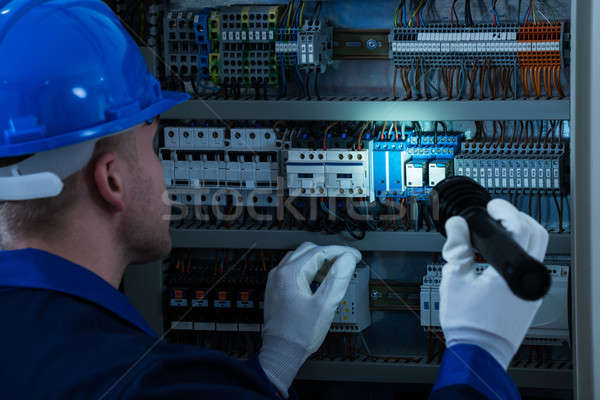 Male Technician Testing Fusebox Stock photo © AndreyPopov