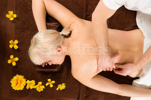 Kobieta powrót masażu młoda kobieta Zdjęcia stock © AndreyPopov