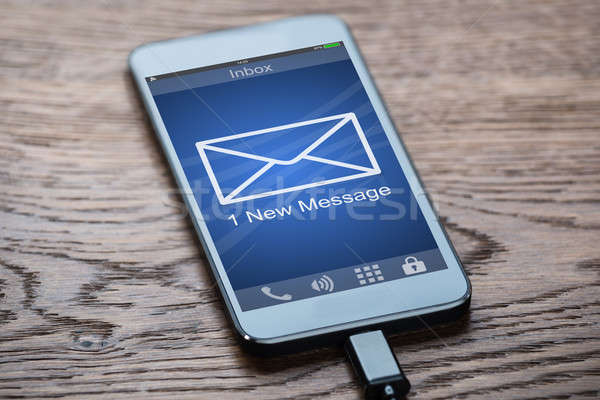 Mobiltelefon egy új üzenet közelkép telefon Stock fotó © AndreyPopov
