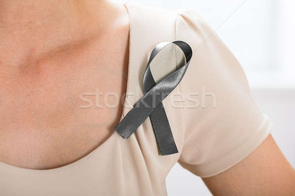 Woman With Grey Ribbon To Support Breast Cancer Cause Stock photo © AndreyPopov