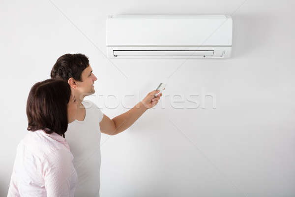 Photo stock: Couple · température · climatiseur · heureux · maison