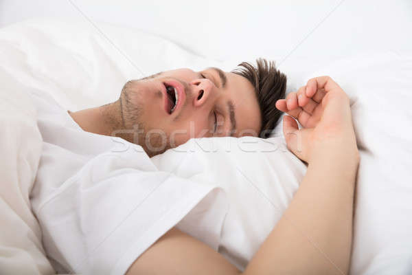 Fáradt fiatalember horkolás kilátás mély alszik Stock fotó © AndreyPopov