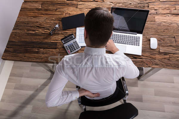 Businessman Suffering From Back Pain Stock photo © AndreyPopov