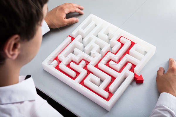 Businessman solving maze Stock photo © AndreyPopov