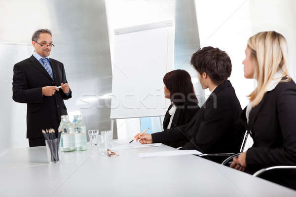 Group of business people at presentation Stock photo © AndreyPopov