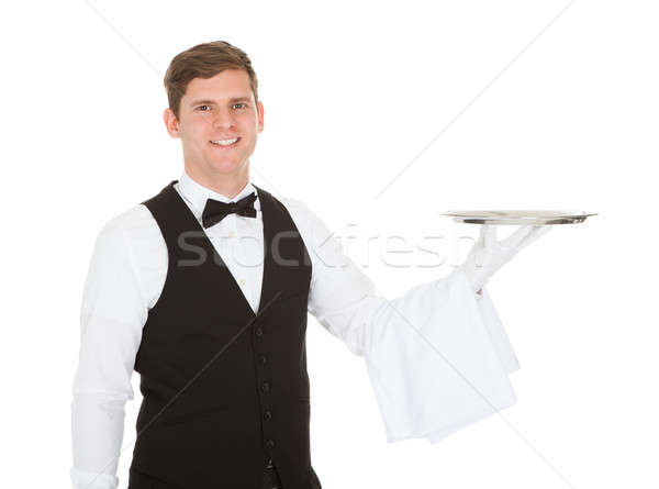 Waiter Holding Empty Silver Tray Stock photo © AndreyPopov