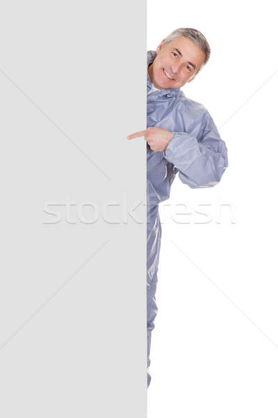 Mature Man Pointing At Blank Placard Stock photo © AndreyPopov