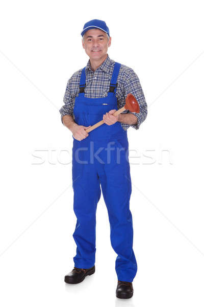 Portrait Of Male Plumber Holding Plunger Stock photo © AndreyPopov