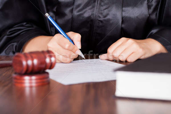 Female Judge Writing On Paper Stock photo © AndreyPopov