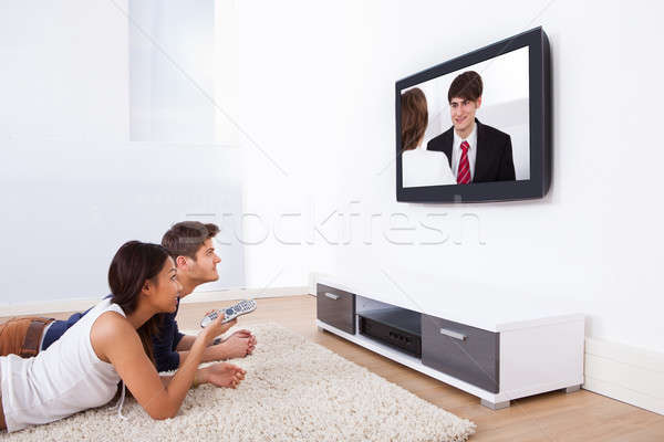 Couple Watching TV At Home Stock photo © AndreyPopov