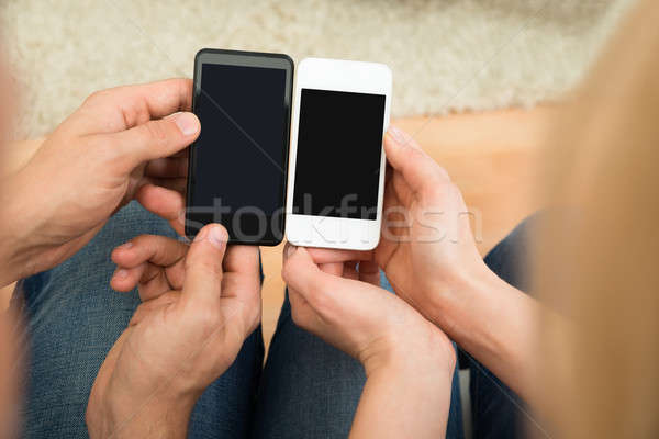 Dwie osoby telefony komórkowe widoku kobieta Zdjęcia stock © AndreyPopov