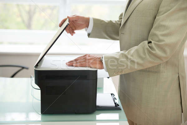 Businessman Using Scanner Stock photo © AndreyPopov