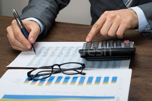 üzletember adó iroda közelkép grafikon papír Stock fotó © AndreyPopov