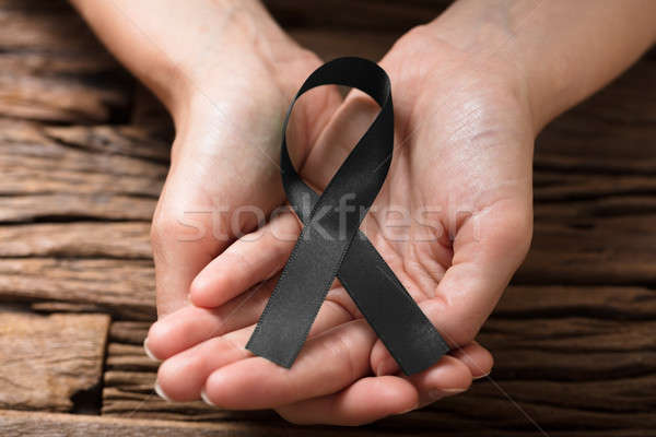 Human Hand Showing Pink Ribbon To Support Breast Cancer Cause Stock photo © AndreyPopov