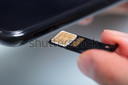 Inserting A Sim Card In A Mobile Phone Stock photo © AndreyPopov