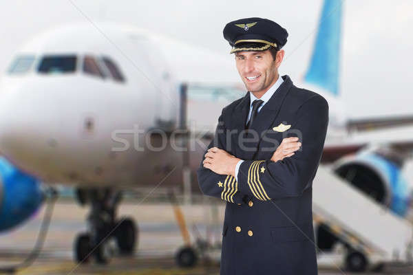 笑みを浮かべて パイロット 折られた 手 肖像 男性 ストックフォト © AndreyPopov