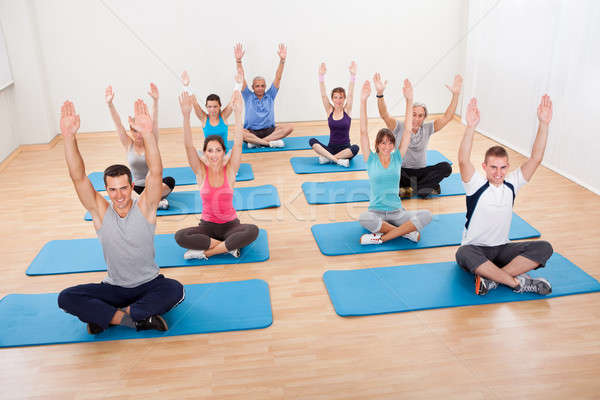 Group of people practicing yoga meditating Stock photo © AndreyPopov