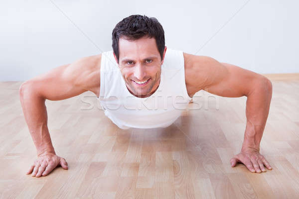 Young Man Performs Pushup Stock photo © AndreyPopov