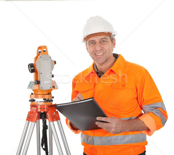 Senior land surveyor with theodolite Stock photo © AndreyPopov