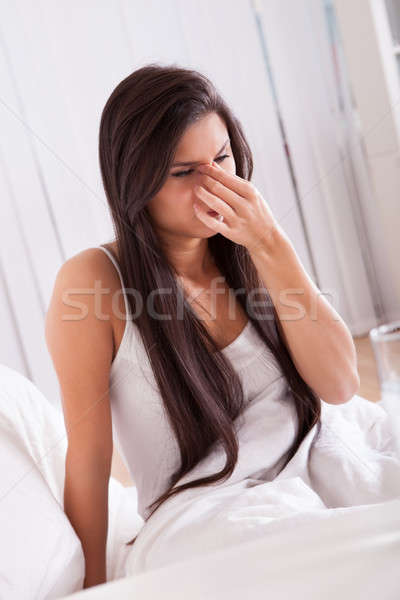 Woman ill in bed with a cold and flu Stock photo © AndreyPopov