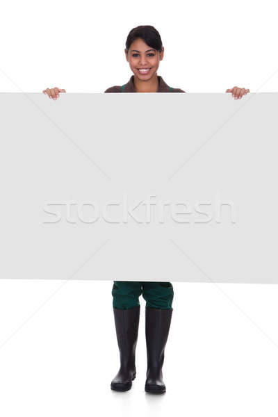 Young Female Gardner Holding Placard Stock photo © AndreyPopov