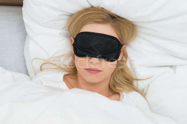 Woman Sleeping With Sleep Mask Stock photo © AndreyPopov