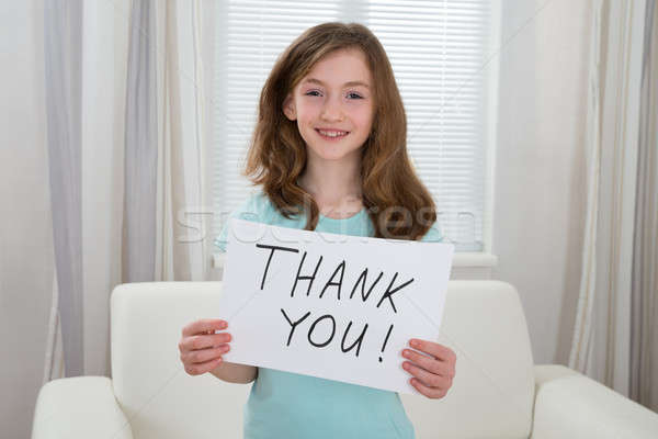 Girl Holding Board With The Text Thank You Stock photo © AndreyPopov