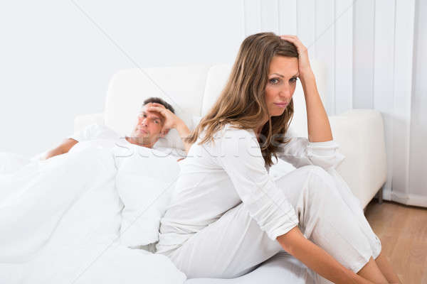 Stock photo: Unhappy Couple In Bedroom