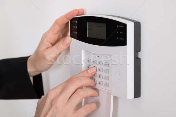 Woman Hand Entering Code In Security System Stock photo © AndreyPopov