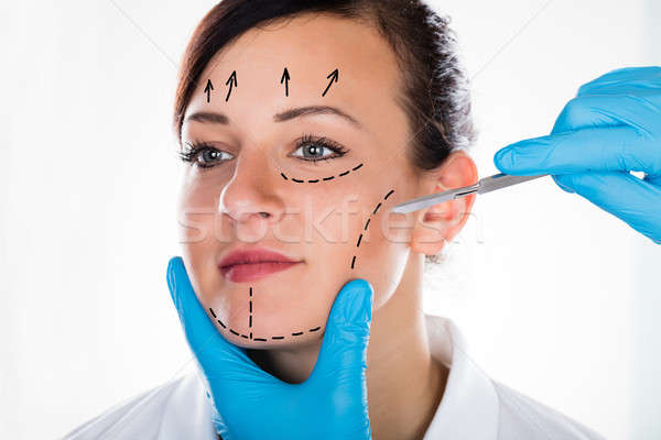 Woman's Face With Correction Line Stock photo © AndreyPopov