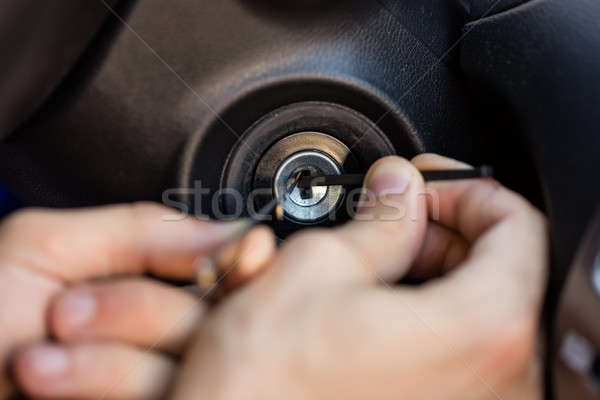 Person Inserting Tool In Key Hole Stock photo © AndreyPopov