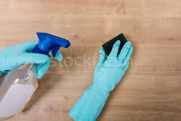 Person Wearing Glove Cleaning Kitchen Worktop Stock photo © AndreyPopov