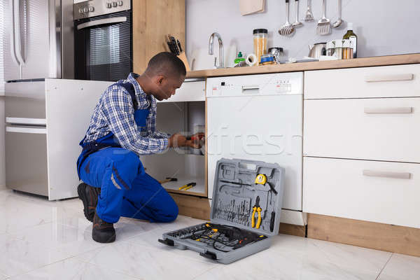 Male Plumber Fixing Sink Pipe Stock photo © AndreyPopov
