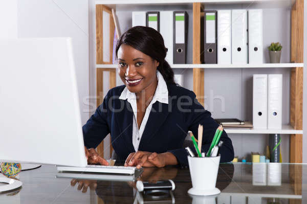 Businesswoman Working On Computer Stock photo © AndreyPopov