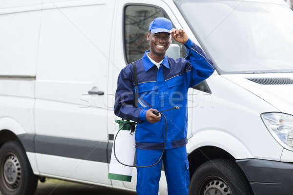 Young Smiling Male Worker With Pesticide Sprayer Stock photo © AndreyPopov