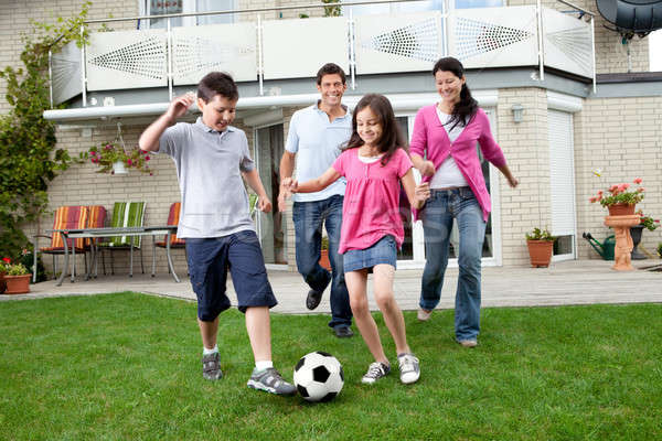 Stock fotó: Boldog · család · játszik · futball · udvar · aranyos · gyerekek · játszanak
