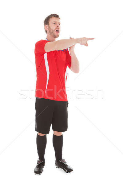 Referee Pointing While Holding Whistle Stock photo © AndreyPopov