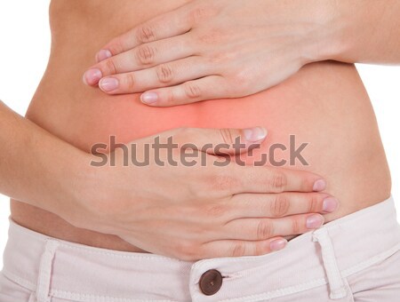 Femme souffrance maux d'estomac jeune femme douleur estomac Photo stock © AndreyPopov