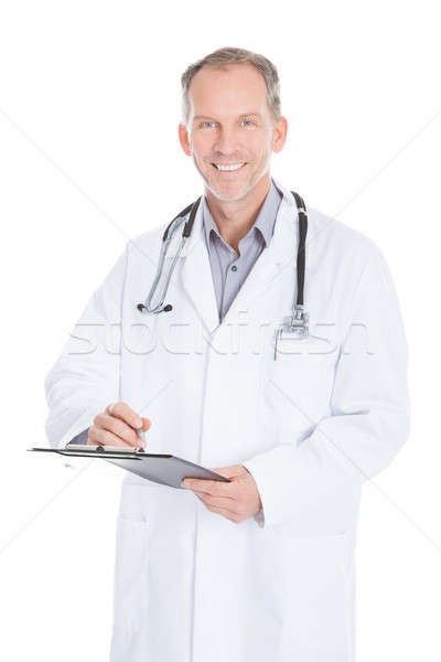 [[stock_photo]]: Médecin · de · sexe · masculin · écrit · presse-papiers · portrait · maturité · médecin