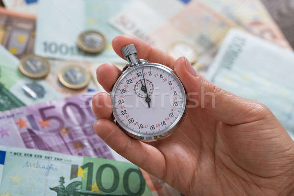 Személy kezek stopperóra pénz közelkép tart Stock fotó © AndreyPopov