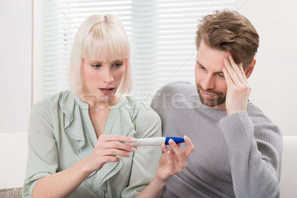 Couple Looking At Pregnancy Tester Stock photo © AndreyPopov