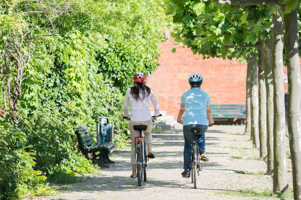 Couple Riding On Bicycles In The Park Stock photo © AndreyPopov