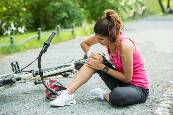 Young Woman Fallen From Bicycle Stock photo © AndreyPopov